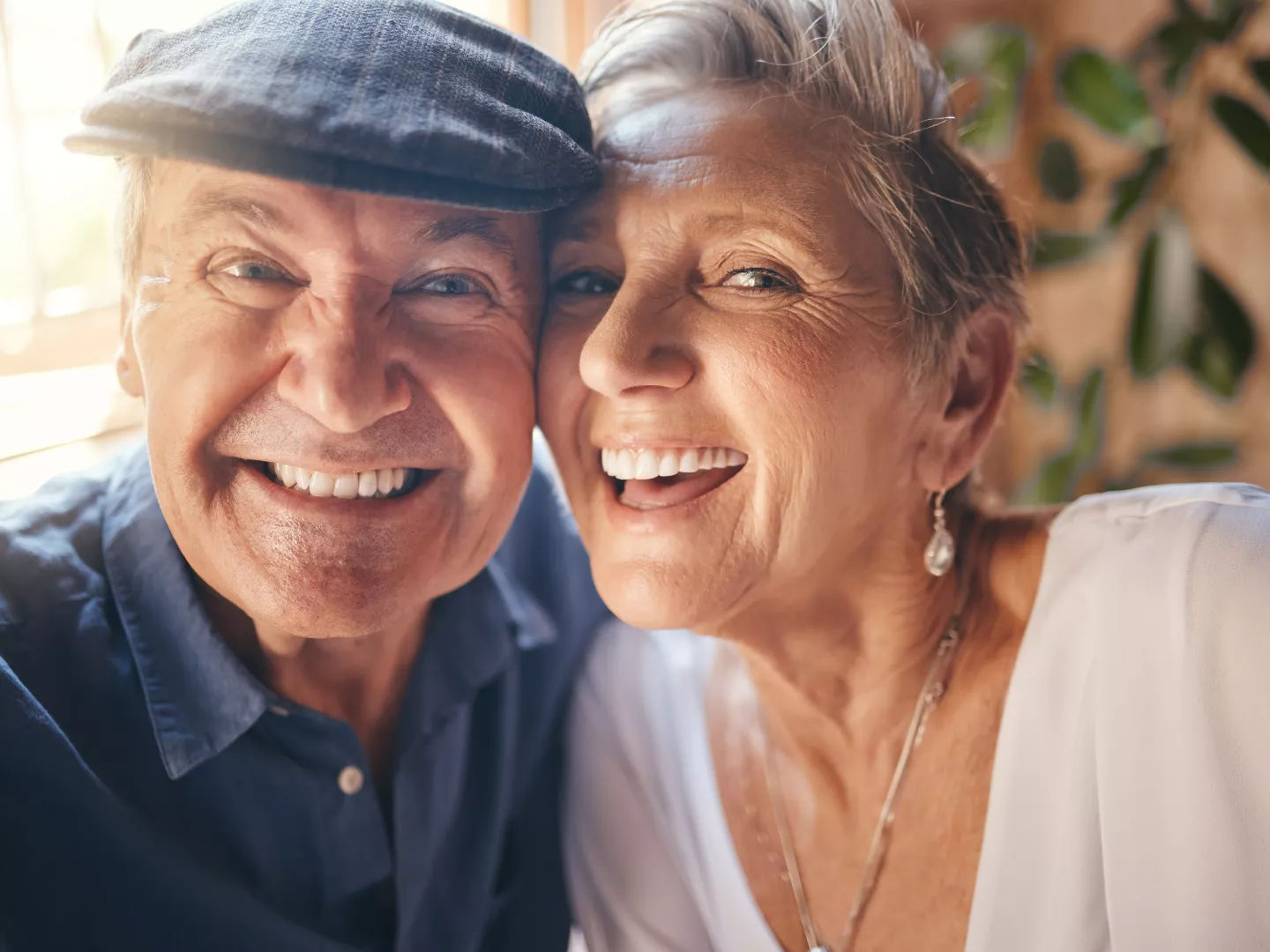 Couple smiling face to face.