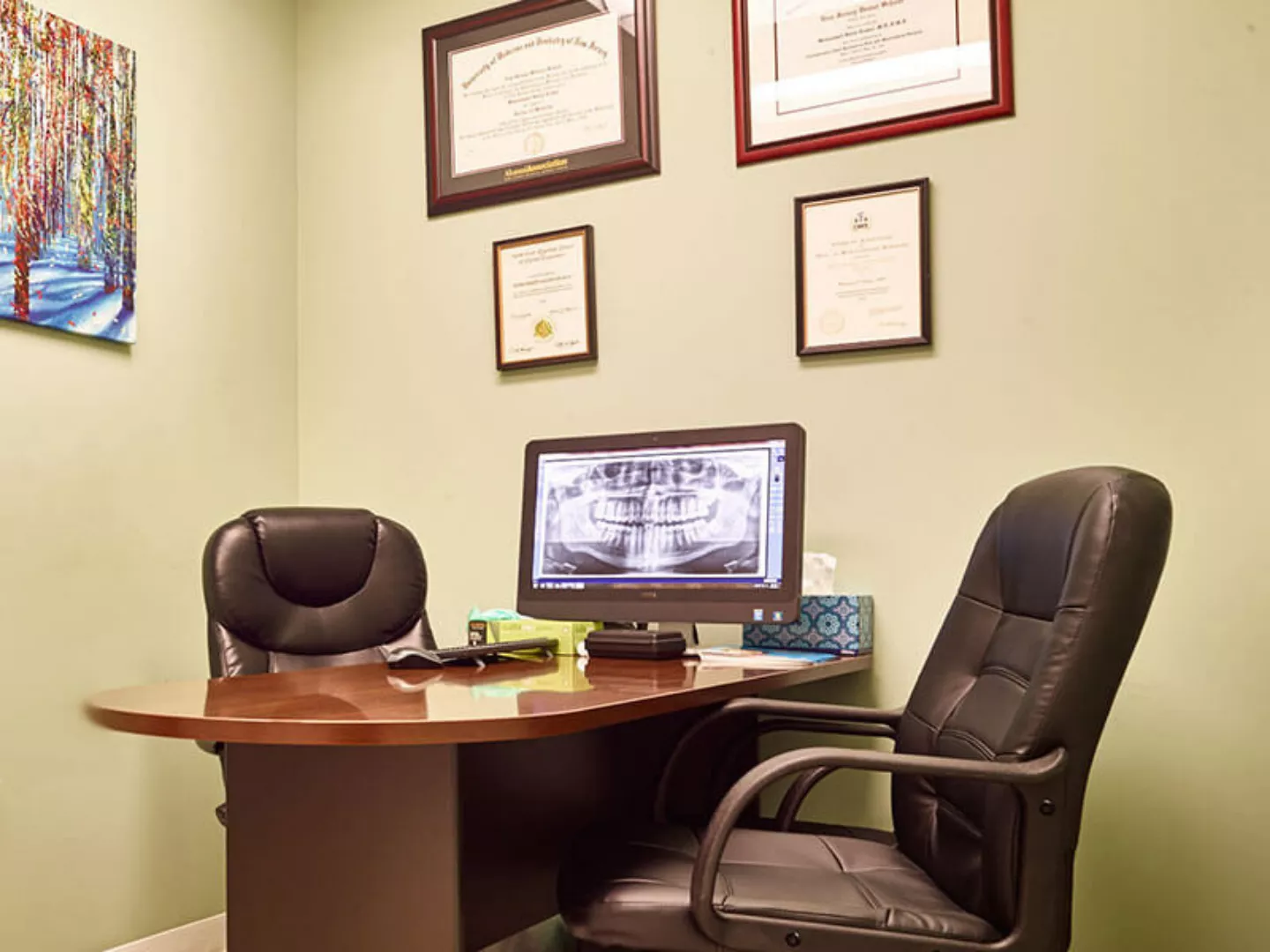 Dr. Erakat's office with certificates on the wall - Prestige Oral Surgery.